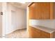 Hallway with built-in cabinets and light-colored flooring at 1964 S Marble St, Gilbert, AZ 85295