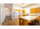 Bright kitchen with light wood cabinets, island, and white appliances at 1964 S Marble St, Gilbert, AZ 85295