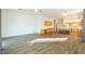 Open concept living room and kitchen area with wood-look tile flooring at 1964 S Marble St, Gilbert, AZ 85295