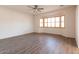 Living room with bay window and wood-look flooring at 1964 S Marble St, Gilbert, AZ 85295