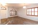 Spacious living room featuring hardwood floors and large windows at 1964 S Marble St, Gilbert, AZ 85295