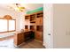 Home office with built-in wooden desk and shelving at 1964 S Marble St, Gilbert, AZ 85295