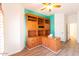 Home office with built-in wooden desk and shelving at 1964 S Marble St, Gilbert, AZ 85295