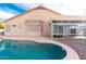 Inviting kidney-shaped pool with a sunroom and expansive backyard at 1964 S Marble St, Gilbert, AZ 85295