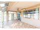 Sunroom with tile flooring, sliding glass doors, and views of the pool at 1964 S Marble St, Gilbert, AZ 85295