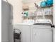 Laundry room with washer, dryer, and shelving at 1976 N Lemon Tree Ln # 52, Chandler, AZ 85224