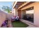 Private patio with seating and landscaping at 1976 N Lemon Tree Ln # 52, Chandler, AZ 85224