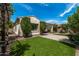 Landscaped backyard with artificial turf and a patio area at 19919 W Lincoln St, Buckeye, AZ 85326