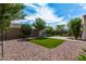 Artificial turf and gravel backyard with a patio area at 19919 W Lincoln St, Buckeye, AZ 85326