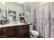 Neat bathroom with a shower/tub combo and a toilet at 19919 W Lincoln St, Buckeye, AZ 85326