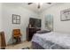 Charming bedroom with a bed, dresser, and record player at 19919 W Lincoln St, Buckeye, AZ 85326