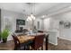 Charming dining area with a marble-top table and stylish light fixture at 19919 W Lincoln St, Buckeye, AZ 85326