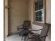 Covered front porch with seating area and decorative accents at 19919 W Lincoln St, Buckeye, AZ 85326