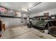 Garage with overhead storage, dog kennel, and room for a Polaris RZR at 19919 W Lincoln St, Buckeye, AZ 85326