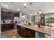 Modern kitchen island with granite countertop and ample cabinet space at 19919 W Lincoln St, Buckeye, AZ 85326