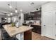 Modern kitchen with dark cabinetry, granite countertops, and stainless steel appliances at 19919 W Lincoln St, Buckeye, AZ 85326