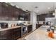 Modern kitchen with dark wood cabinets and ample counter space at 19919 W Lincoln St, Buckeye, AZ 85326