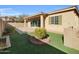 Spacious backyard with artificial turf and well-manicured landscaping at 2091 E Geronimo St, Chandler, AZ 85225