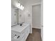 Bathroom boasts a vanity with modern fixtures and wood-look tile floor at 2091 E Geronimo St, Chandler, AZ 85225