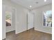 Spacious bedroom with wood-look tile floor and two windows at 2091 E Geronimo St, Chandler, AZ 85225