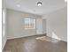 Well-lit bedroom with wood-look tile flooring at 2091 E Geronimo St, Chandler, AZ 85225