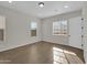 Bedroom with two windows and wood-look tile flooring at 2091 E Geronimo St, Chandler, AZ 85225