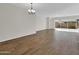 Spacious dining area with wood-look tile floor and access to backyard at 2091 E Geronimo St, Chandler, AZ 85225