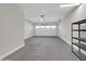 Two-car garage with automatic garage door and shelving at 2091 E Geronimo St, Chandler, AZ 85225