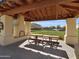 Covered picnic area with a fireplace and wooden seating at 2091 E Geronimo St, Chandler, AZ 85225