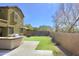 Artificial turf backyard with outdoor kitchen and seating at 23306 N 40Th Pl, Phoenix, AZ 85050