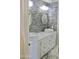 Modern bathroom boasts double sinks, stylish tile, and updated fixtures at 23306 N 40Th Pl, Phoenix, AZ 85050