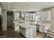 Modern kitchen with white cabinets, large island, and stainless steel appliances at 23306 N 40Th Pl, Phoenix, AZ 85050