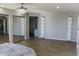 Main bedroom with wood flooring, mirrored closets, and a private bathroom at 23306 N 40Th Pl, Phoenix, AZ 85050