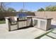 Stainless steel appliances and granite countertops in outdoor kitchen at 23306 N 40Th Pl, Phoenix, AZ 85050