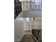 Elegant staircase with wrought iron railing leading to the second floor at 23306 N 40Th Pl, Phoenix, AZ 85050