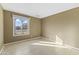 Simple bedroom with tile floors and a window offering natural light at 2348 W Laurel Ln, Phoenix, AZ 85029