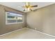 Well-lit bedroom with tile floors and a window at 2348 W Laurel Ln, Phoenix, AZ 85029