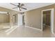 Well-lit bedroom with mirrored closet doors and ensuite bathroom access at 2348 W Laurel Ln, Phoenix, AZ 85029