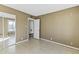 Bright bedroom with mirrored closet doors and access to a hallway at 2348 W Laurel Ln, Phoenix, AZ 85029