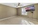 Cozy bedroom featuring tile floors and a large window at 2348 W Laurel Ln, Phoenix, AZ 85029