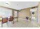 Simple dining area with a wooden table and chairs at 2348 W Laurel Ln, Phoenix, AZ 85029