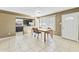 Dining area with a view into the kitchen and access to the backyard at 2348 W Laurel Ln, Phoenix, AZ 85029