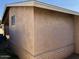 Side view of home showing stucco wall and brick base at 2348 W Laurel Ln, Phoenix, AZ 85029