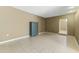 Simple living room with tile floors and a built-in cabinet at 2348 W Laurel Ln, Phoenix, AZ 85029