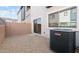 Small backyard with gravel ground cover and AC unit at 2822 W White Feather Ln, Phoenix, AZ 85085