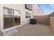 View of backyard with sliding glass door access and gravel at 2822 W White Feather Ln, Phoenix, AZ 85085