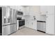 Modern kitchen with stainless steel appliances and white shaker cabinets at 2822 W White Feather Ln, Phoenix, AZ 85085