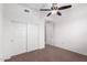 Bedroom with double door closet and ceiling fan at 3330 S Gilbert Rd # 2001, Chandler, AZ 85286