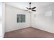 Spacious bedroom with ceiling fan and large window at 3330 S Gilbert Rd # 2001, Chandler, AZ 85286