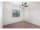 Bedroom with ceiling fan and large window at 3330 S Gilbert Rd # 2001, Chandler, AZ 85286